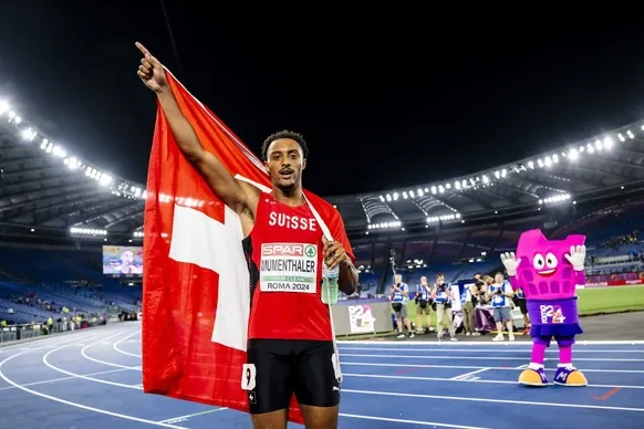 Gold medalist Timothe Mumenthaler of Switzerland celebrates during the men's 200 meters final at the European Athletics Championships, in the Olympic stadium, in Rome, Italy, Monday, June 10, 202 ...